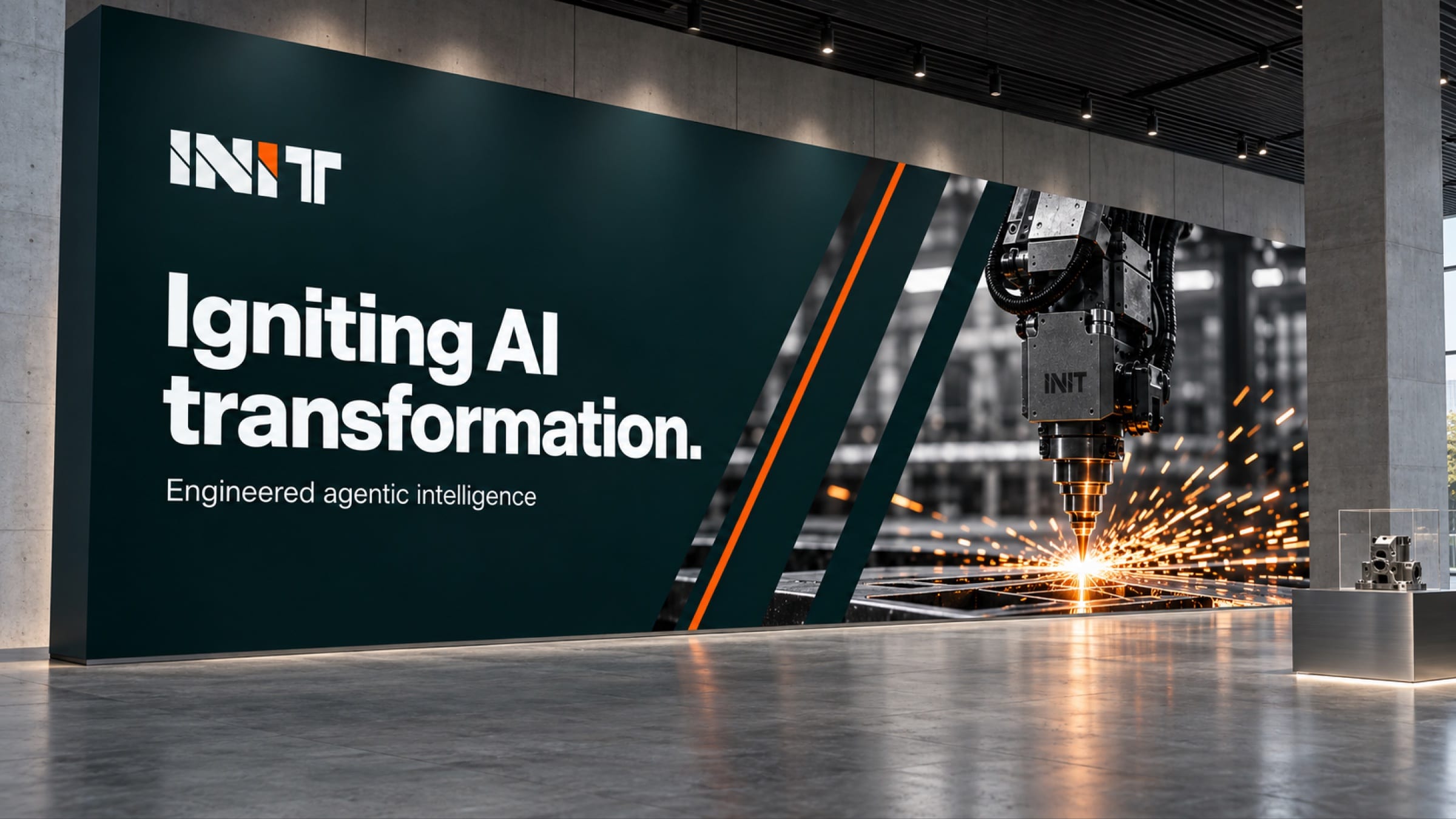 A large obsidian wall graphic in a concrete hall: Igniting AI transformation beside a machine head throwing sparks between diagonal teal and orange bands.