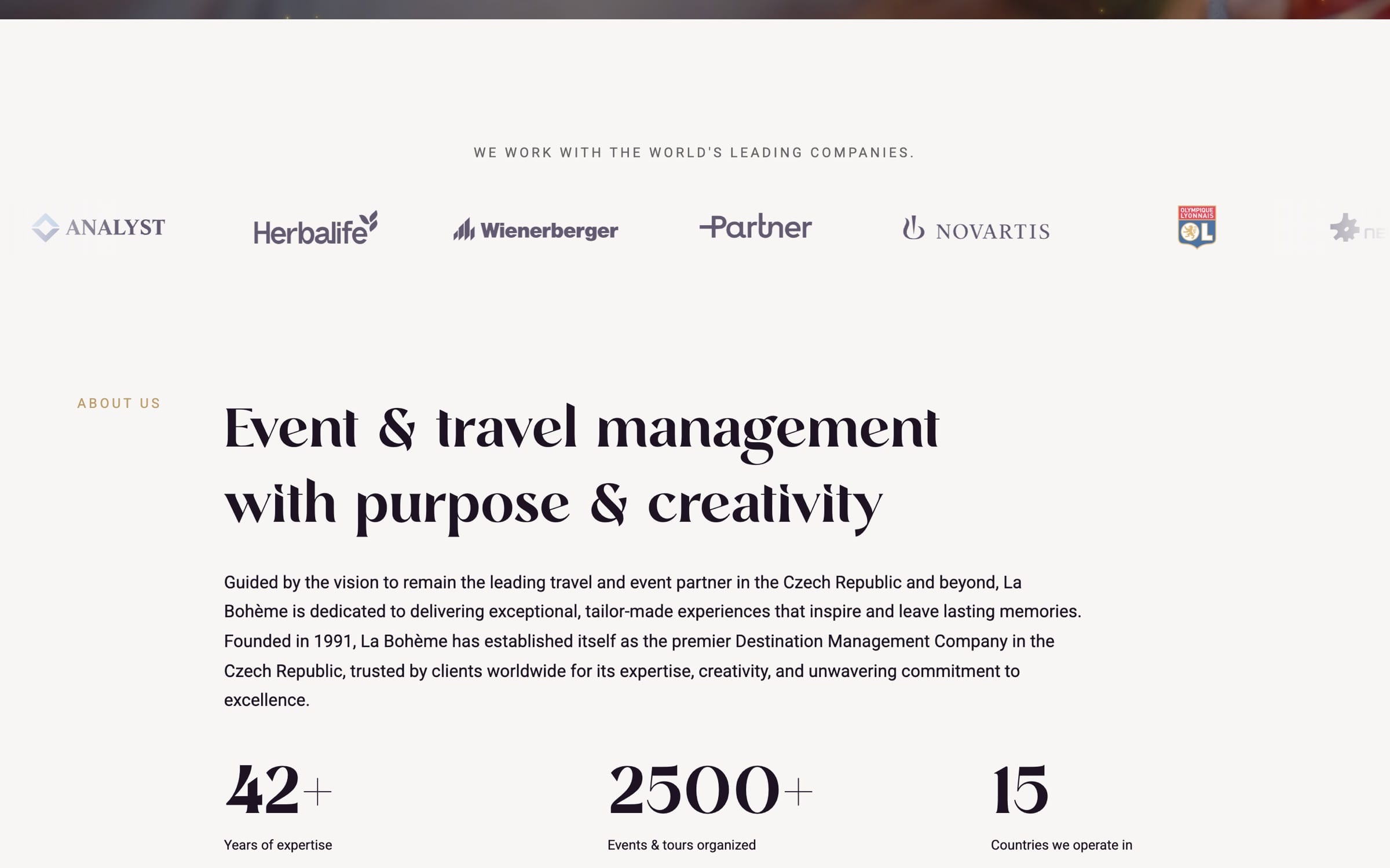 An ivory section: “We work with the world’s leading companies” above a row of client logos including Herbalife, Wienerberger and Novartis, then “Event & travel management with purpose & creativity”.