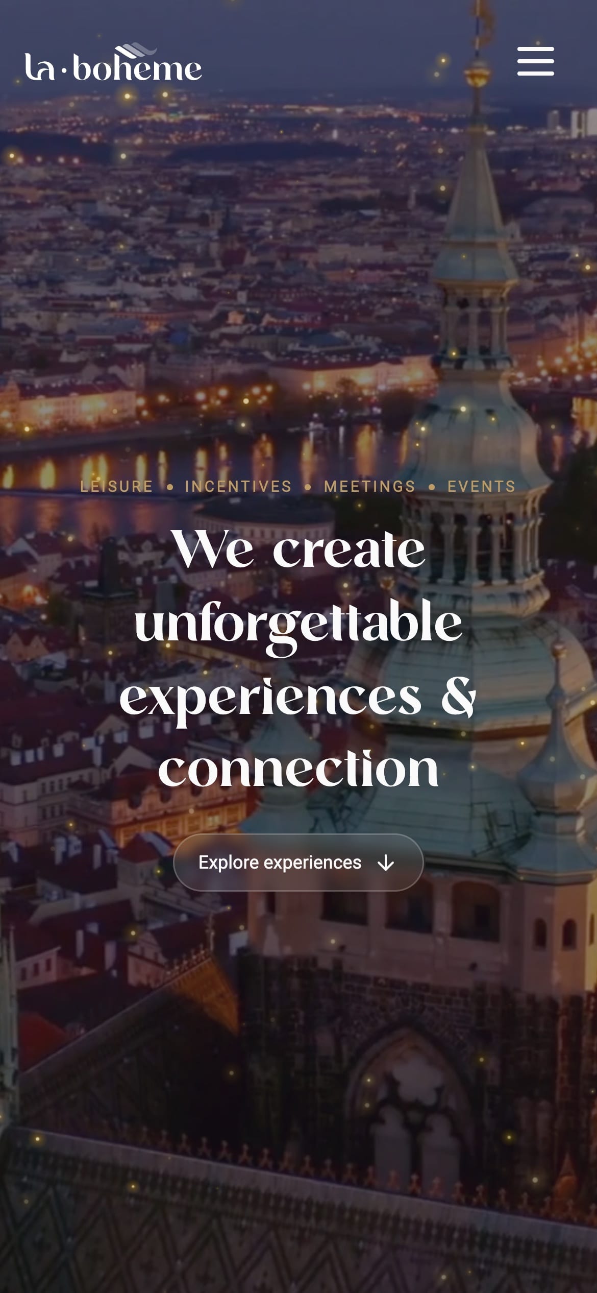 The la-boheme.co hero on a phone: the serif headline over dusk footage of Prague, with an “Explore experiences” button.