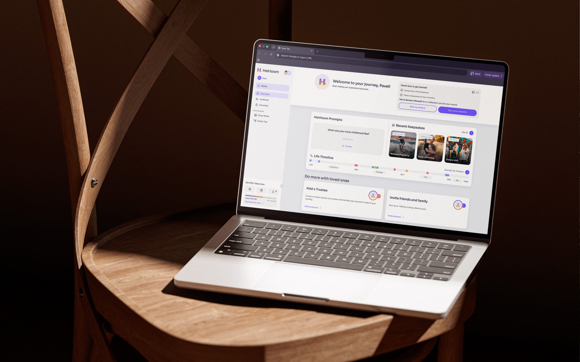 A laptop on a wooden chair showing the Heirloom dashboard.