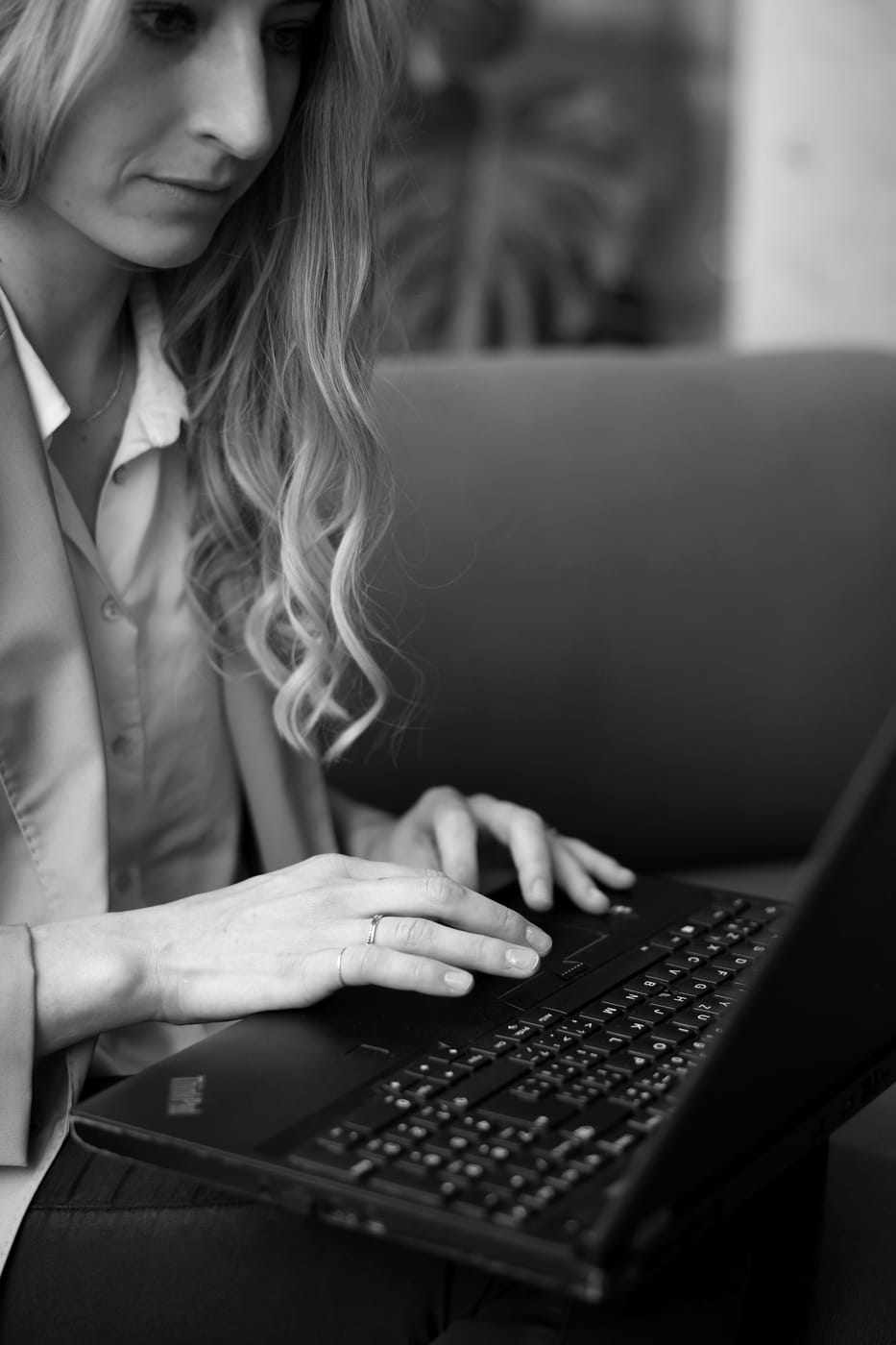 Close-up of Lucie Krulich working on a laptop.